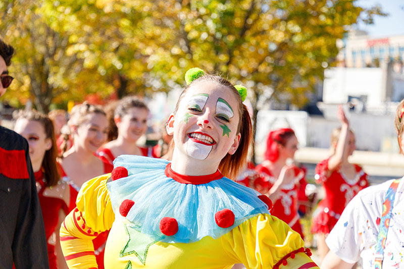 Gamma Phi Circus student dressed as a clown.